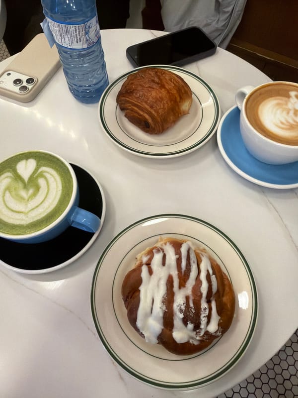 Pastries and coffee at Montreal cafe table