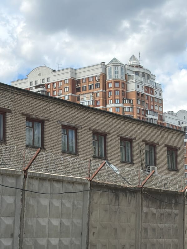 Mixed urban architecture — spires, high-rises, brick facades, street details