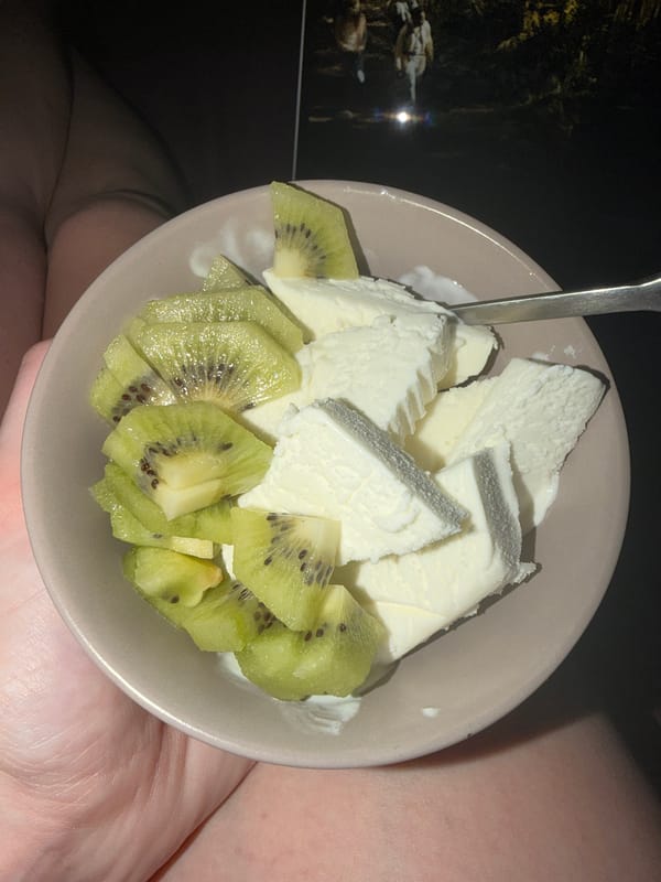 Person enjoys ice cream with kiwi in Novoaleksandrovka