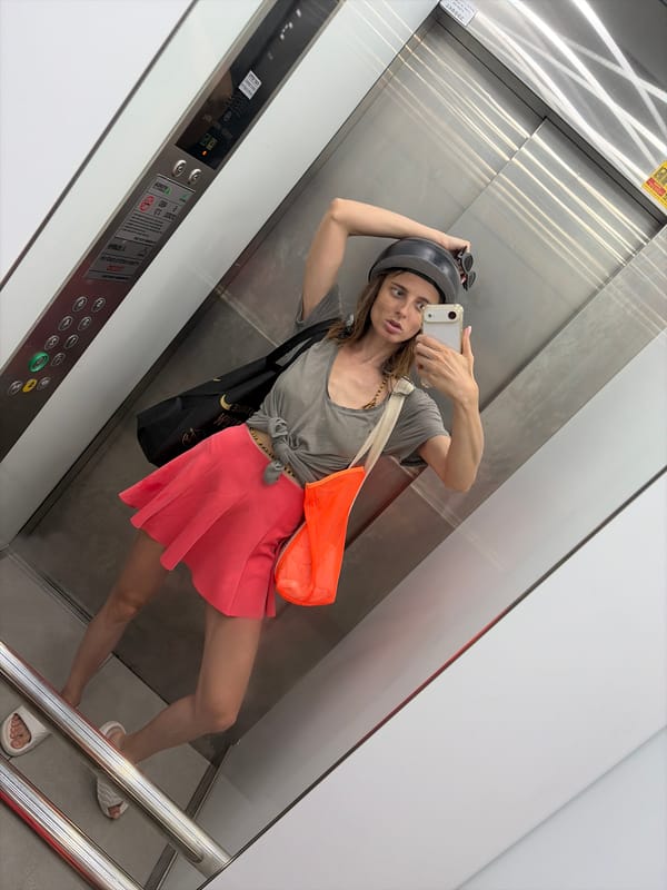 Elevator selfie in Tel Aviv, helmet in tow