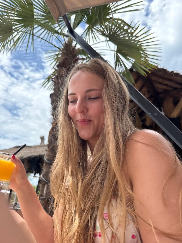 Relaxing with orange juice at a Vlora beach bar