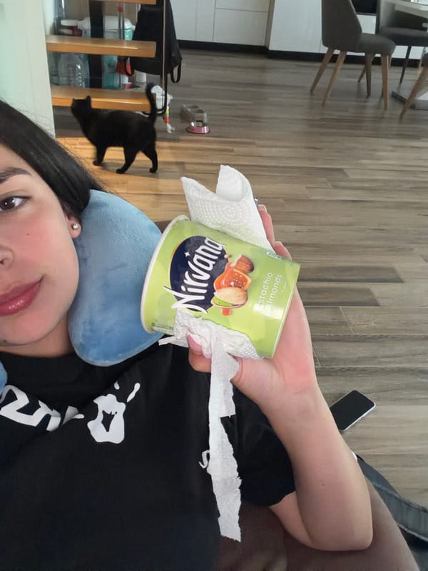 Woman enjoys ice cream on couch in Gabrovo