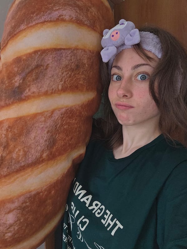Woman takes playful selfies with pig headband in Chita
