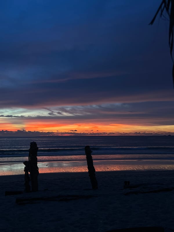 Sunset on the beach, waves, vivid skies, and shoreline movement