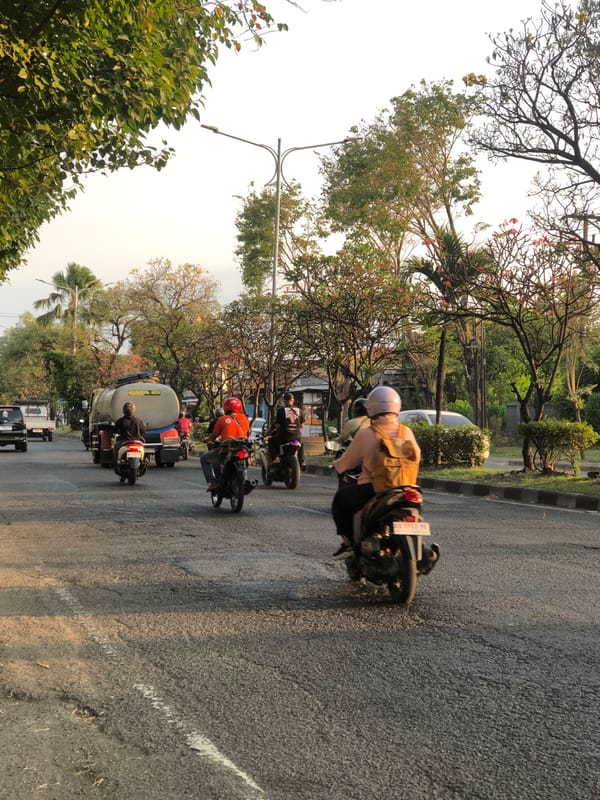 Busy morning traffic on a main road through Gelam, Indonesia