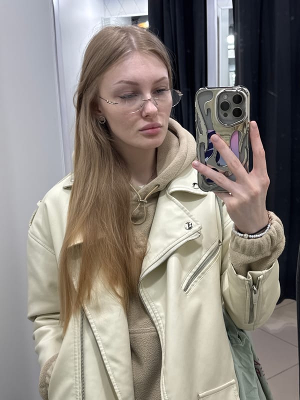 Woman takes mirror selfies in Perm fitting room