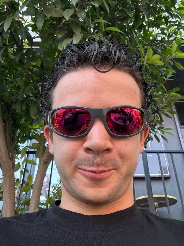 Man takes selfie with red-lens sunglasses in Tashkent restaurant