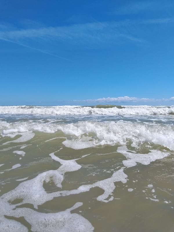 Summer morning beach scenes captured in Peschici, Italy