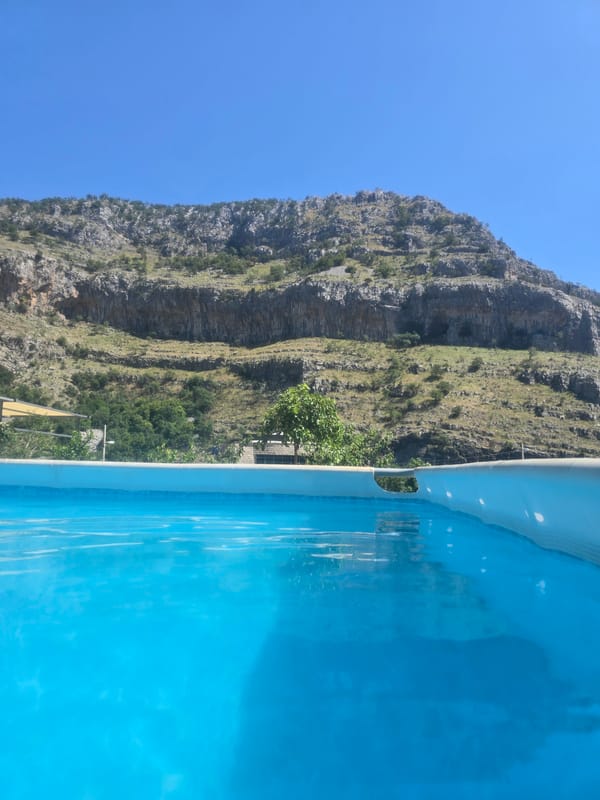 Pool day in the mountains with floats and a rubber duck