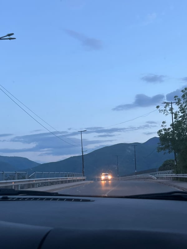 Vehicle crosses bridge near Septemvri, Bulgaria at dusk