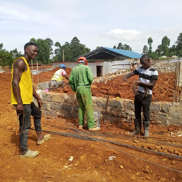 Construction worker performs manual labor in Borabu Chitago ward