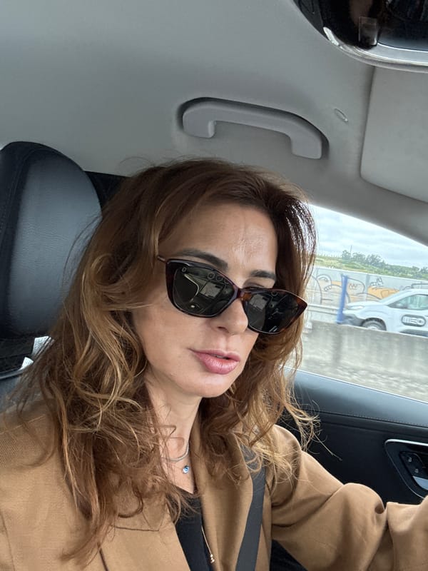 Woman photographed in car passenger seat in Loures