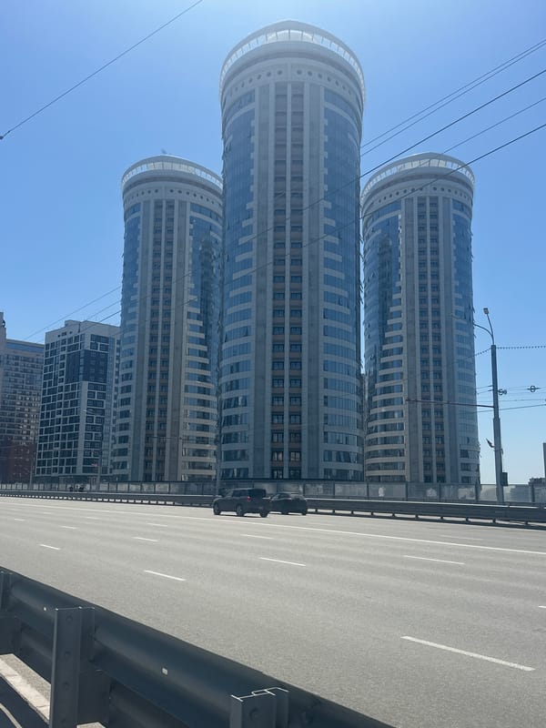 Clear morning captures Novosibirsk's urban landscape and highway