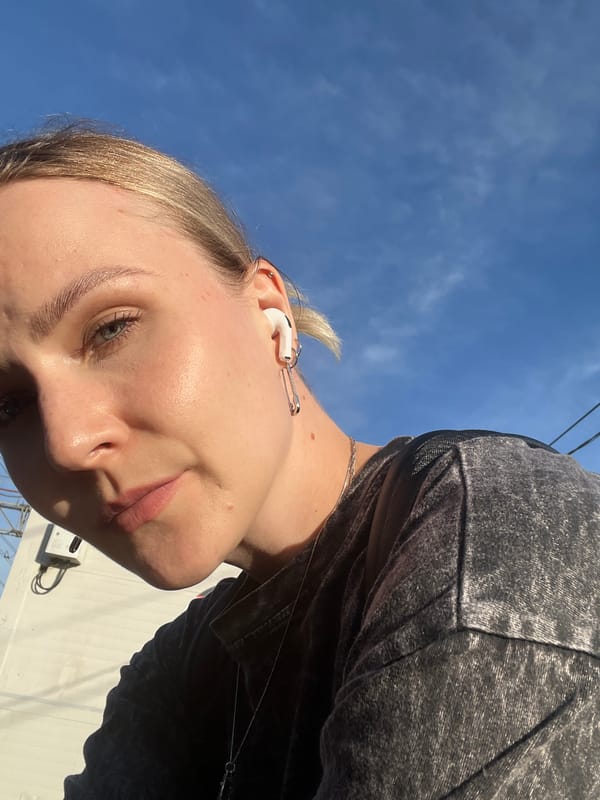 Quick selfie series near Khimki with earbuds and outdoor backdrop