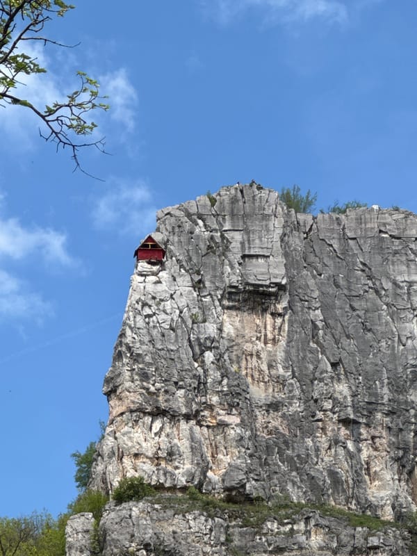 Spring morning captures Bulgaria's rocky cliffs and cascading waterfall