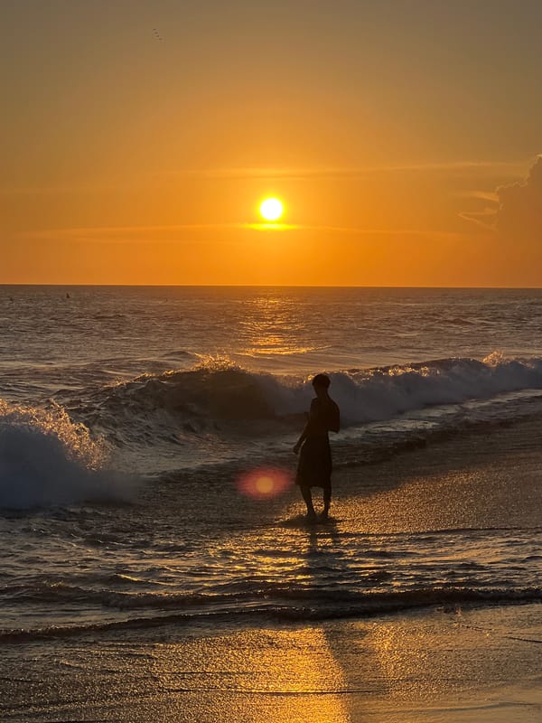 Beach vendor and surf rental activity documented in North Kuta