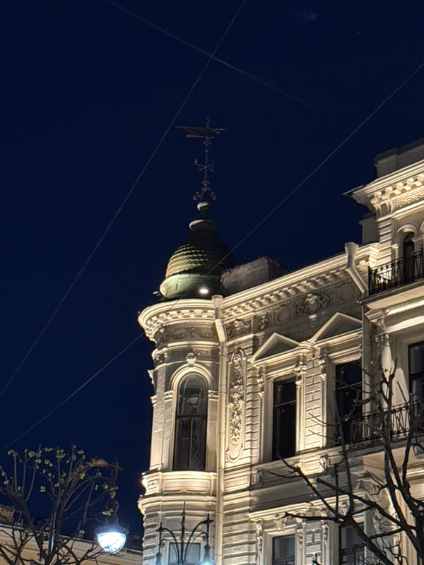 Illuminated building facade captured at night in Saint Petersburg