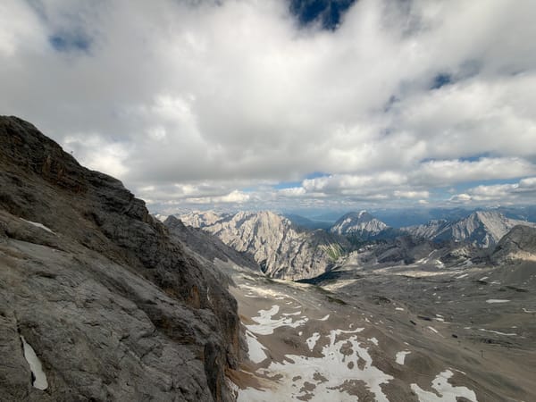 High on the rocks above Garmisch, cloudy skies overhead