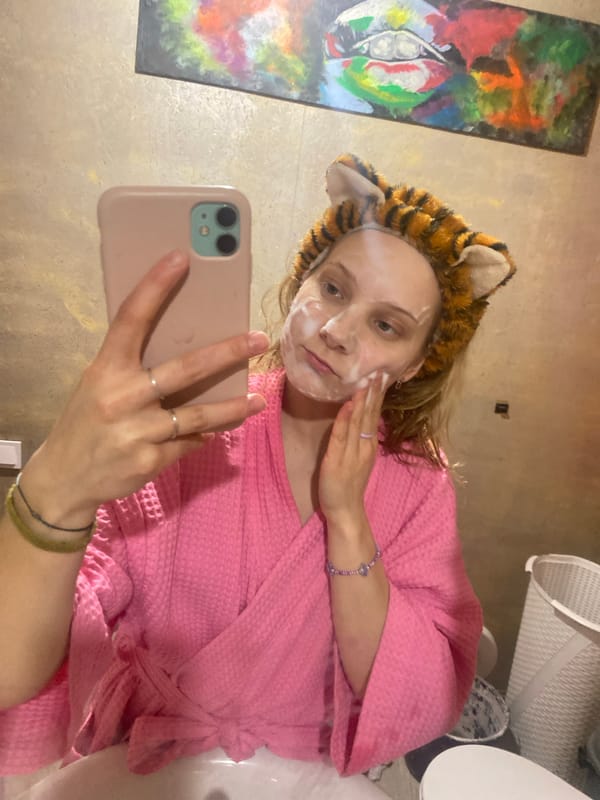 Woman takes selfie during beauty routine in Chaikovsky