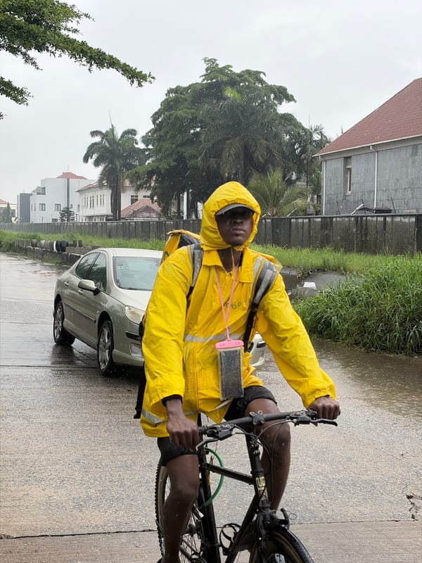Commuters and delivery riders navigate Igboefon streets in heavy rain