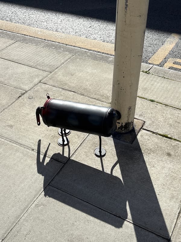 Street-mounted cylindrical object documented in London