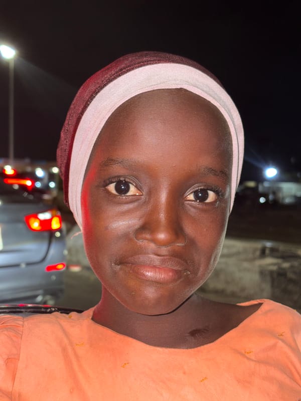 Two women photographed together in Alaguntan, Nigeria evening