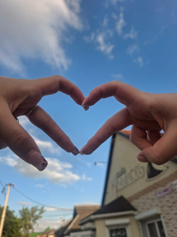 Blue-sky afternoon: hand hearts, street cats, and urban textures