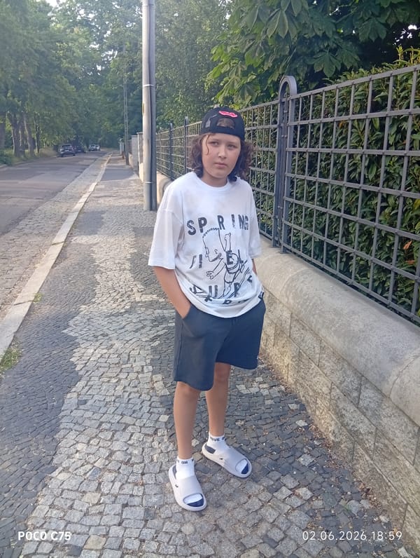 Young person photographed on cobblestone street in Wrocław