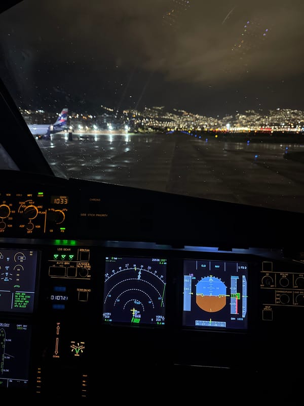 Night landing approach captured from aircraft cockpit over Peru