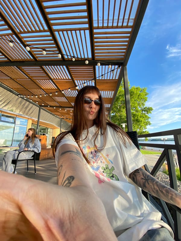 Friends gather at waterfront cafe in Votkinsk for afternoon drinks