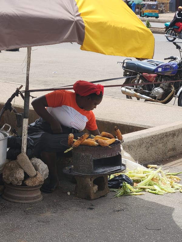 Street vendor sells grilled corn in Kabong, Nigeria
