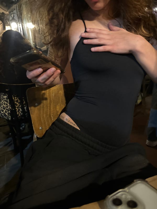 Person dines on green salad at Tel Aviv cafe