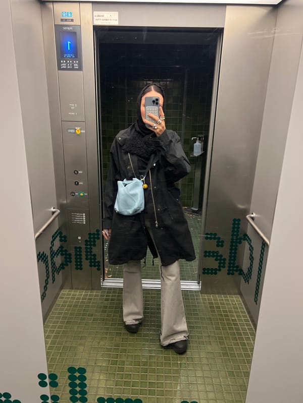 Person takes elevator mirror selfie in Shibuya