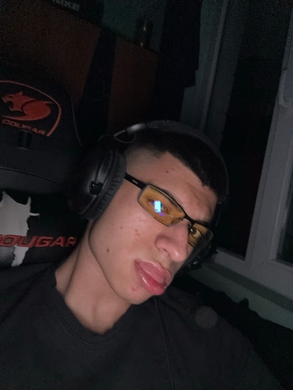 Gamer rests in chair with headphones in Sofia