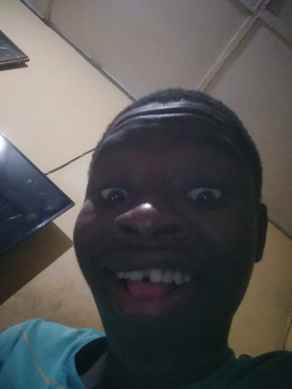 Resident takes selfie at home in Shangisha, Nigeria
