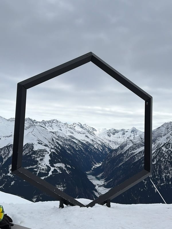 Man dines outdoors at Austrian ski resort during snowfall