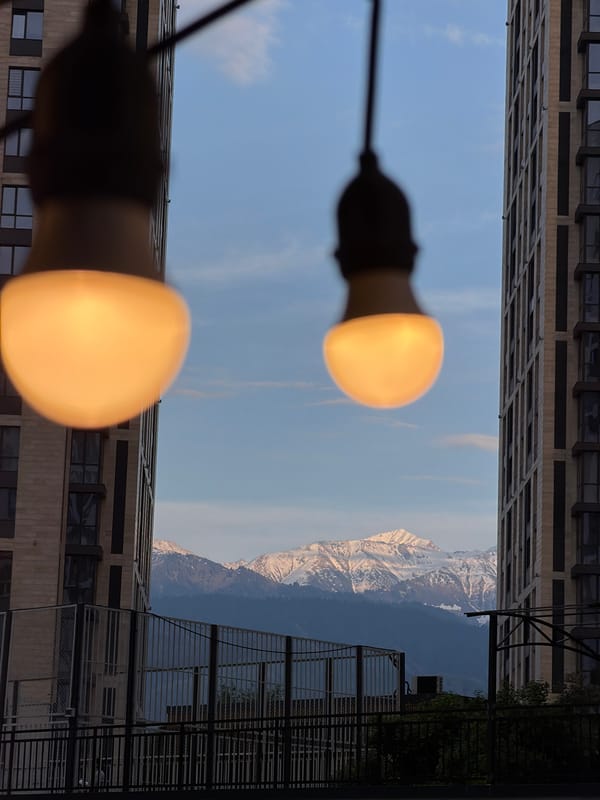 Almaty resident captures Tian Shan mountain views between city buildings
