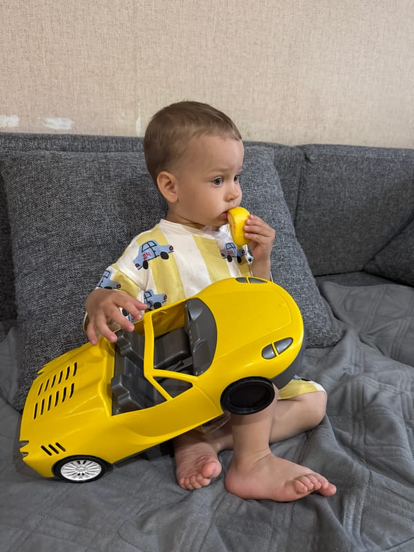 Child rests on sofa in Шебунино, Russia