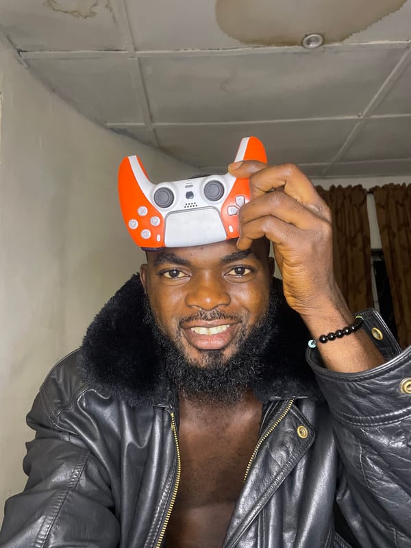 Man poses with gaming controllers in Jos photoshoot session