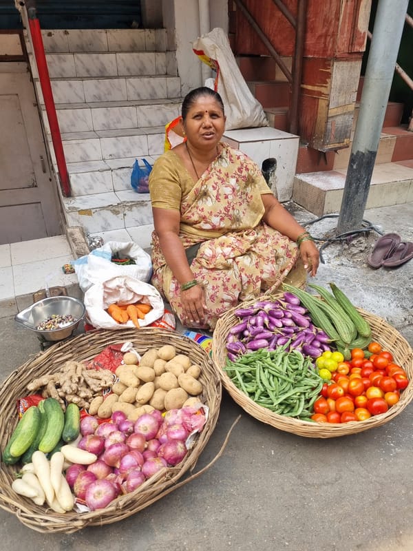 Early morning street commerce and daily life in Puttaparthi
