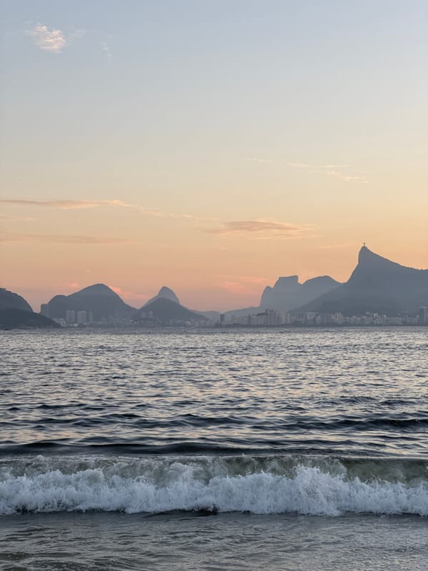 Niterói beach at dusk, Rio's skyline across the water
