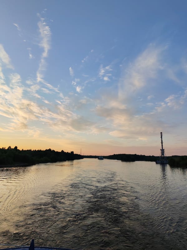 Sunset over a working river at Annensky Most