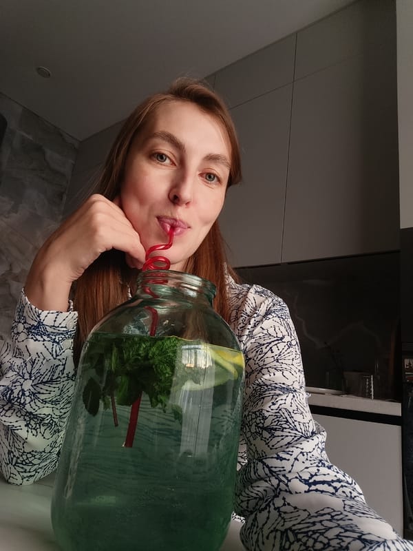 Woman documents quiet evening at home with cat in Chaikovsky