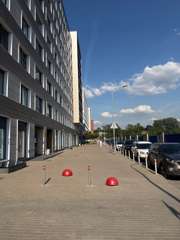 Urban street documentation captures modern buildings and Orthodox church