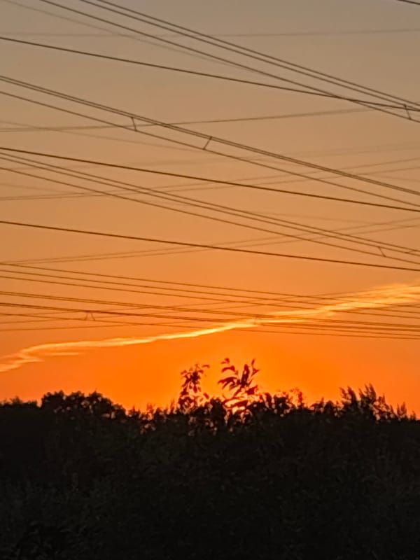 Sunset observed over power lines in Chaikovsky, Russia