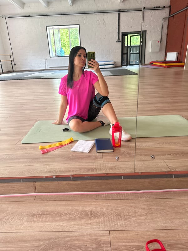 Woman exercises with knee brace at gym morning session
