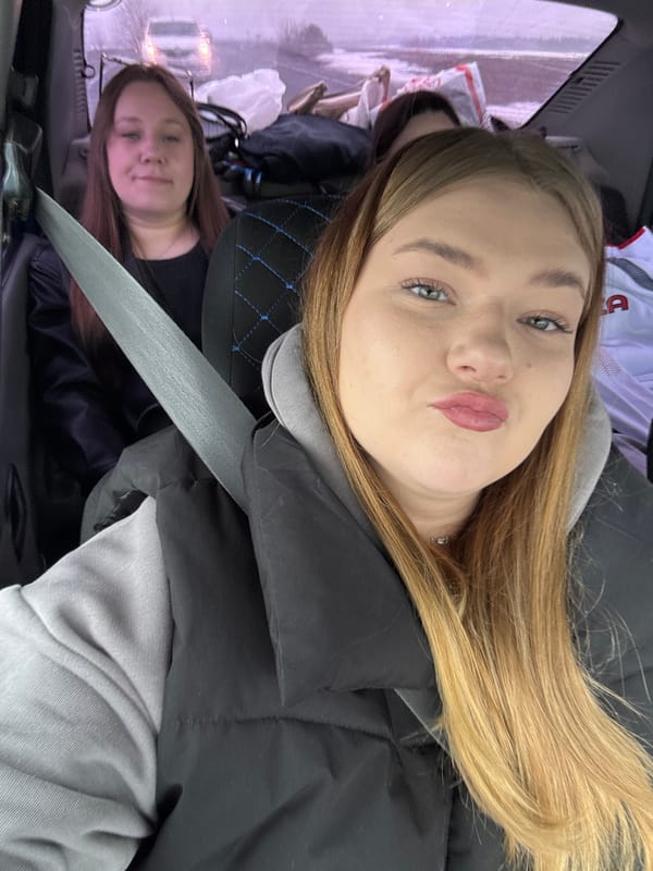 Two women observed in vehicle backseat in Perevoznoe, Russia
