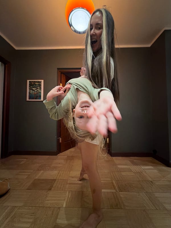 Woman and child play indoors in Khimki home