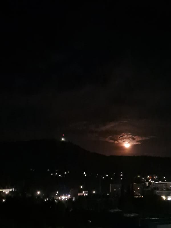 Bright moon observed over water in Gabrovo, Bulgaria