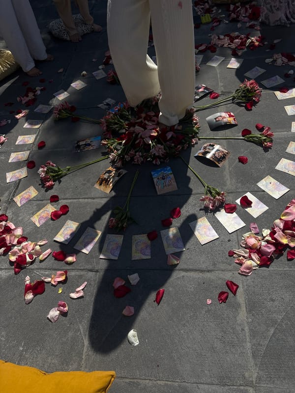Memorial arrangement with cards, rose petals spotted in Puebla